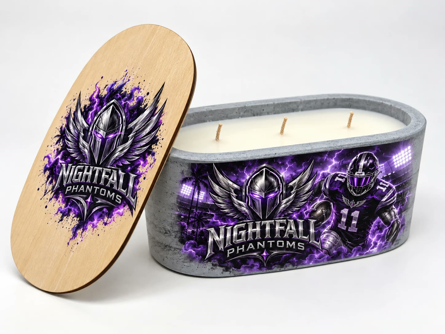 Concrete candle wrapped in purple lightning art of a helmeted football player, the Nightfall Phantoms lid leaning beside it.